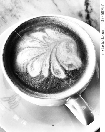 Black and white coffee art. Monochrome cappuccino. Latte art. Black and white coffee art. Monochrome cappuccino. Latte art. 135868797