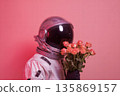 Astronaut With Pink Rose Bouquet in Surreal Space Scene on Soft Pink Background 135869157