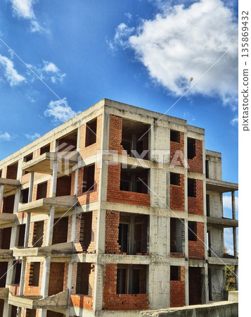 construction phase of a brick apartment complex construction phase of a brick apartment complex 135869432