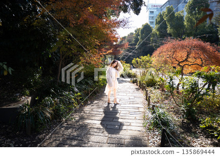 Autumn leaves and women Autumn leaves and women 135869444