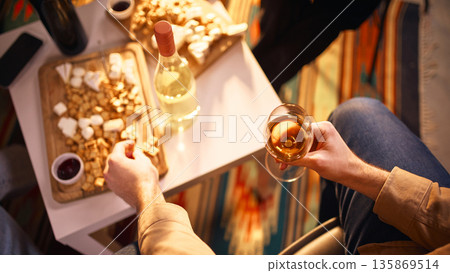 Top view of people drinking wine at home gathering Top view of people drinking wine at home gathering 135869514