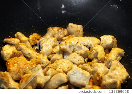 chicken pieces fried in frying pan chicken pieces fried in frying pan 135869668