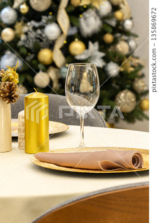 Elegant table decoration for a christmas dinner Elegant table decoration for a christmas dinner 135869672