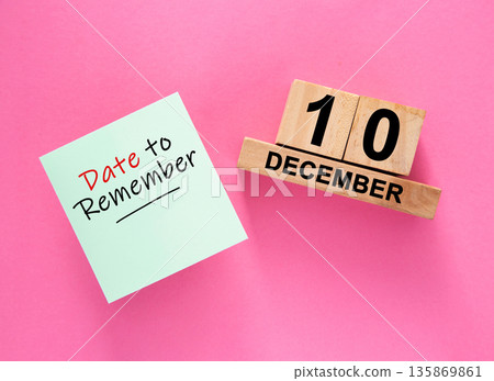 Date December 10 to remember concept with sticky note and wooden calendar Date December 10 to remember concept with sticky note and wooden calendar 135869861