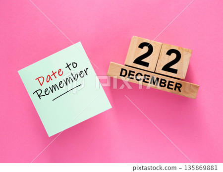 Date December 22 to remember concept with sticky note and wooden calendar Date December 22 to remember concept with sticky note and wooden calendar 135869881