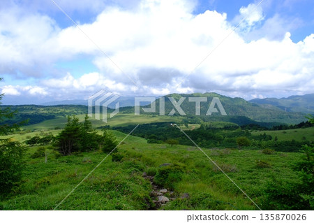 Summer clouds spread across the Japanese plateau and lush mountain scenery Summer clouds spread across the Japanese plateau and lush mountain scenery 135870026