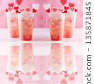 Refreshing drink with gummy red hearts 135871845