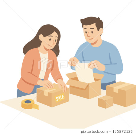 The couple is packing goods into boxes. The couple is packing goods into boxes. 135872125