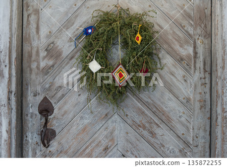 Wooden door with Christmas decoration 135872255