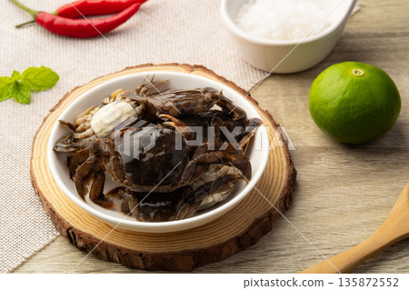 Salted crab,preserved crab with salt in white plate 135872552