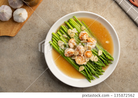 Asparagus with Shrimp and Garlic thick Sauce in white plate.Top view. Asparagus with Shrimp and Garlic thick Sauce in white plate.Top view. 135872562
