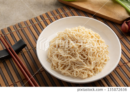Shirataki with oat fiber,Oat noodles with konjac in white plate.low calorie,high fiber,no fat.food for weight loss. Shirataki with oat fiber,Oat noodles with konjac in white plate.low calorie,high fiber,no fat.food for weight loss. 135872636