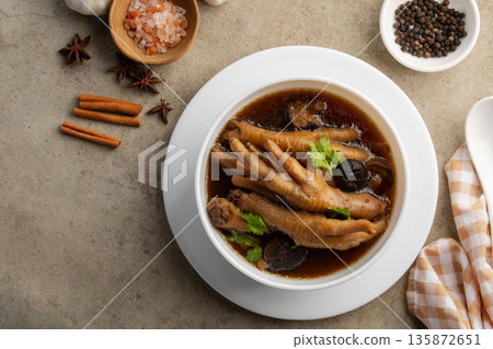 Chicken Feet in Five Spices Soup,is a flavorful and collagen-rich dish, popular in Chinese and Thai cuisine.Top view. Chicken Feet in Five Spices Soup,is a flavorful and collagen-rich dish, popular in Chinese and Thai cuisine.Top view. 135872651