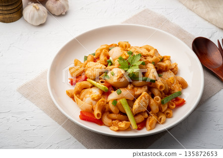 Stir Fried Macaroni with chicken breast tomatoes and egg in Tomato Sauce.fusion food Stir Fried Macaroni with chicken breast tomatoes and egg in Tomato Sauce.fusion food 135872653