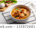 Red curry Pineapple and shrimp in white bowl.(Kang Kua Subpharod Kung) Thai food. 135872681