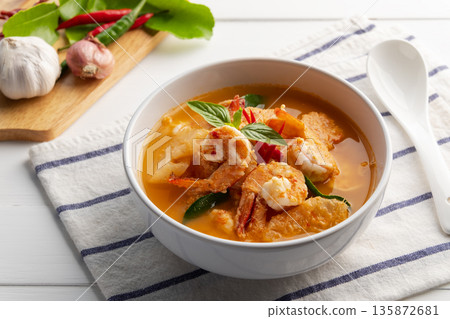 Red curry Pineapple and shrimp in white bowl.(Kang Kua Subpharod Kung) Thai food. Red curry Pineapple and shrimp in white bowl.(Kang Kua Subpharod Kung) Thai food. 135872681