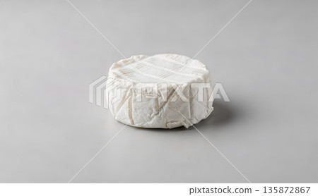 Fresh Goat Cheese Wheel on Neutral Background 135872867