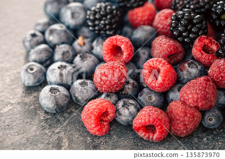 Background from different berries, raspberries, blueberries and blackberries. 135873970
