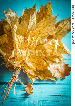 beautiful autumn leaves on wooden background 135874001