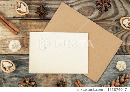 Blank paper, concert, cones and spices on a wooden background, flat lay. 135874047