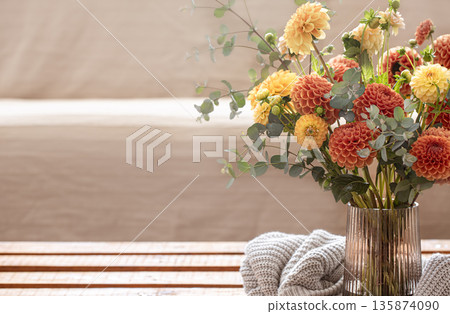 Bouquet of chrysanthemums in a vase in the interior of the room, copy space. 135874090