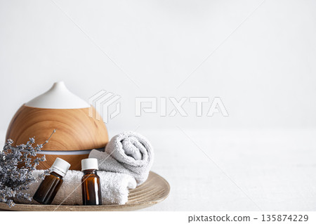Spa composition with aroma diffuser and aromatic oils copy space. Spa composition with aroma diffuser and aromatic oils copy space. 135874229