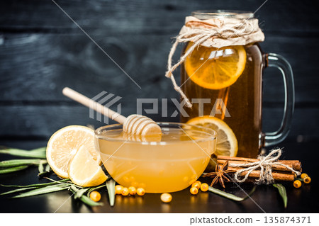 the composition of tea with lemon and honey 135874371