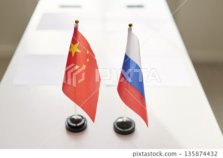 China and Russia desk flags on meeting table symbolizing bilateral negotiations China and Russia desk flags on meeting table symbolizing bilateral negotiations 135874432