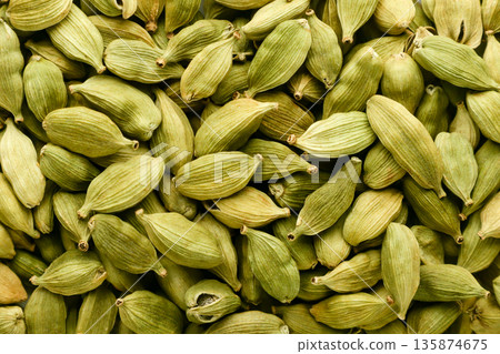 Cardamom pods background. Top view Cardamom pods background. Top view 135874675