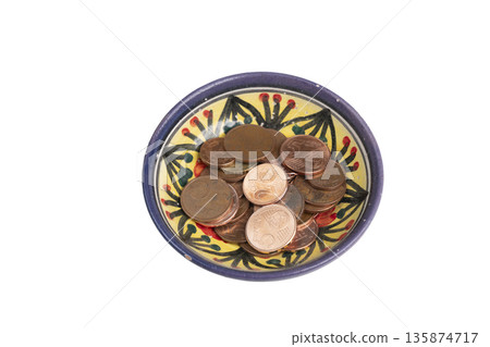 a bowl decorated with some euro coins a bowl decorated with some euro coins 135874717