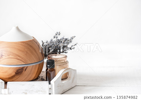 Spa composition with aroma diffuser and natural lavender oil copy space. Spa composition with aroma diffuser and natural lavender oil copy space. 135874982