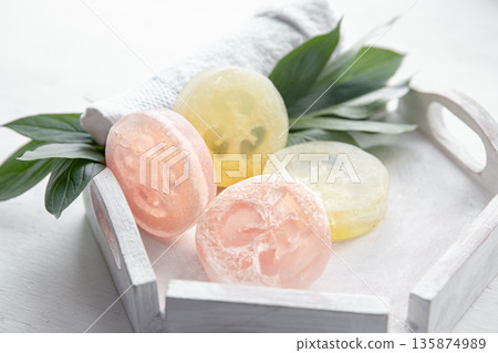 Spa still life with towel and loofah close up. 135874989