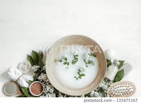Spa composition with water for beauty treatments and fresh flowers. 135875167
