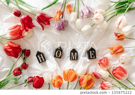 Spring background with flowers tulips and decorative word Home. Spring background with flowers tulips and decorative word Home. 135875222