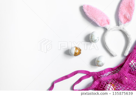 Festive Easter background with eggs and string bag, copy space. Festive Easter background with eggs and string bag, copy space. 135875639
