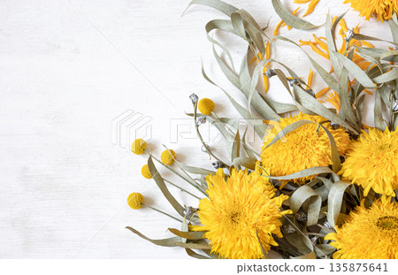 Autumn flat lay composition with sunflowers on a white background. Autumn flat lay composition with sunflowers on a white background. 135875641