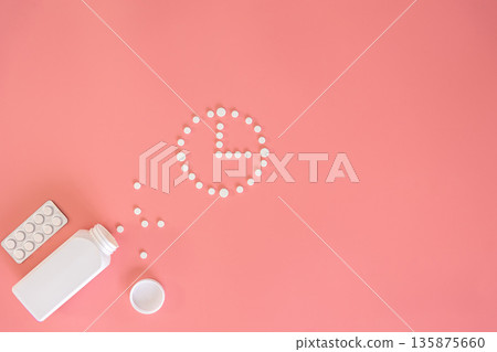 Flat lay, pills on a pink background, conceptual minimalism, medicine. 135875660