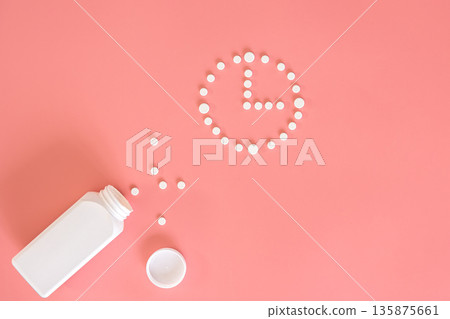 Flat lay, pills on a pink background, conceptual minimalism, medicine. 135875661