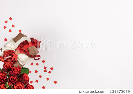 Flat lay, white background with gift box and valentine's day decor details. Flat lay, white background with gift box and valentine's day decor details. 135875679
