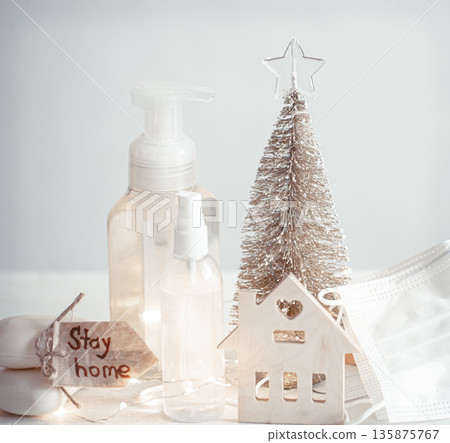 Christmas background with coronavirus personal protective equipment and decor details copy space. 135875767