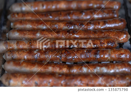 Homemade barbecue in nature. Roasting meat on a grid. 135875798