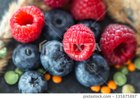 Natural background with different wild berries, macro shot. 135875897