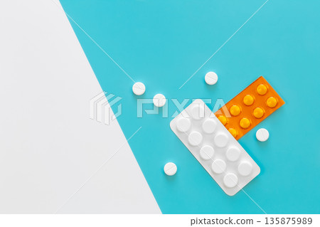 Pills on a blue background, flat lay, copy space. Pills on a blue background, flat lay, copy space. 135875989