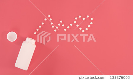 Pills on pink background, flat lay, medicine concept. Pills on pink background, flat lay, medicine concept. 135876003
