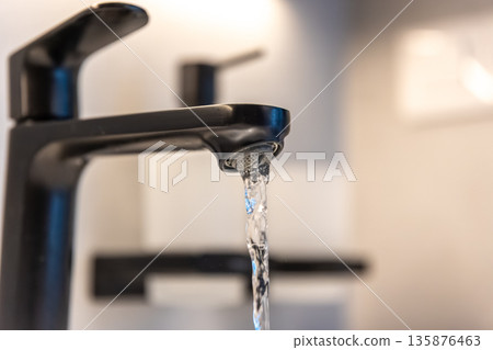 Black tap macro. Water flow. Minimal aesthetic Black tap macro. Water flow. Minimal aesthetic 135876463