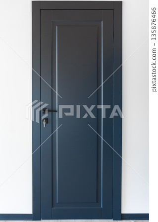 Blue door with keys. Matte minimalism. Black hardware. 135876466