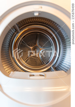 Drum closeup. Perforation symmetry. Modern dryer 135876499