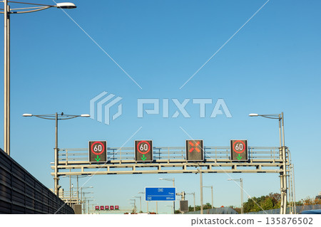 Electronic speed limit signs on highway. Smart road by day. Electronic speed limit signs on highway. Smart road by day. 135876502