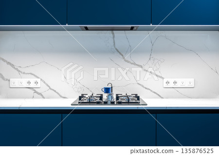 Gas stove closeup. Marble wall. Sleek modern kitchen interior. Gas stove closeup. Marble wall. Sleek modern kitchen interior. 135876525