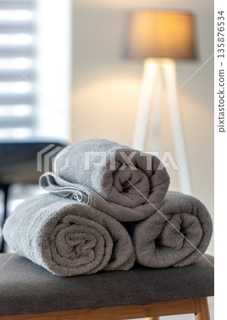Gray spa towels on table. Minimal cozy mood Gray spa towels on table. Minimal cozy mood 135876534